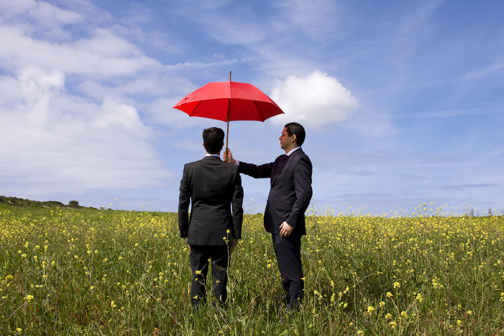 business man holding umbrella O'Fallon MO